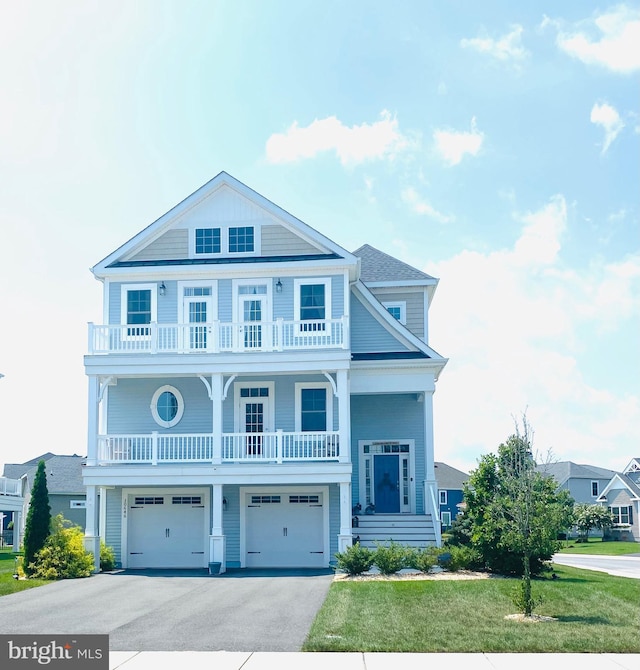 view of front of home featuring a front yard and a garage