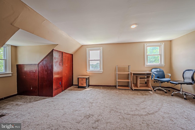 bonus room featuring lofted ceiling and carpet floors