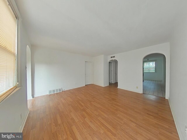 spare room with light hardwood / wood-style flooring