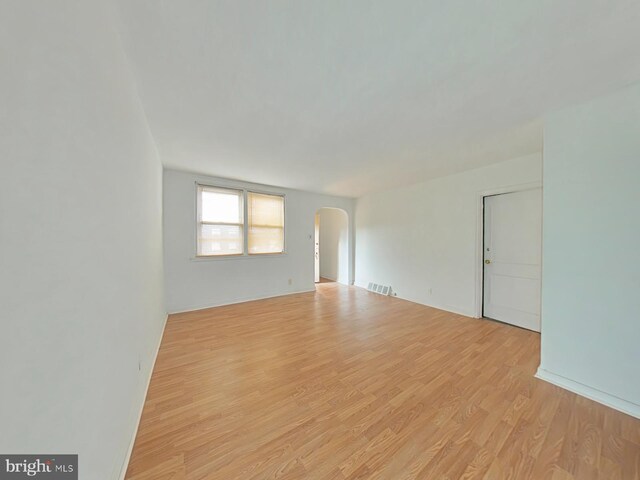 unfurnished room featuring light hardwood / wood-style floors