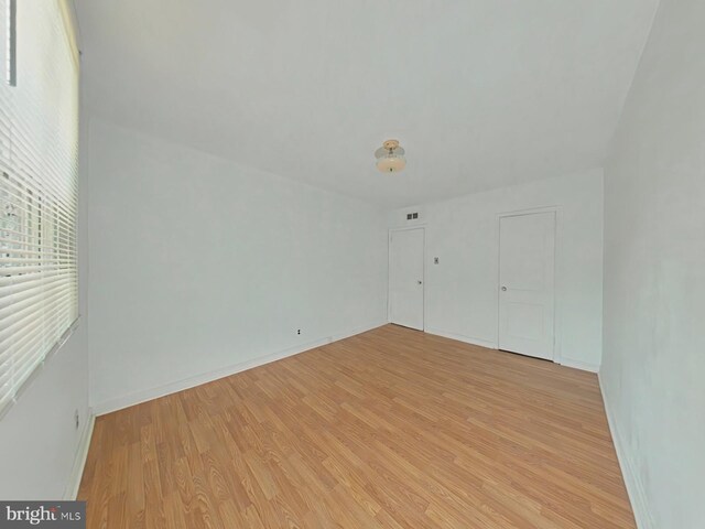 unfurnished room featuring light hardwood / wood-style flooring