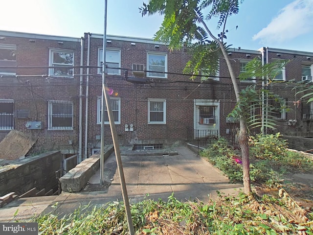 back of property featuring a patio