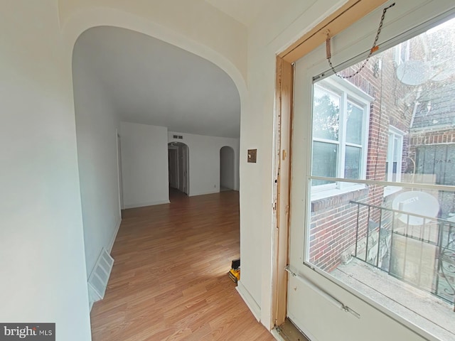 corridor featuring light hardwood / wood-style flooring