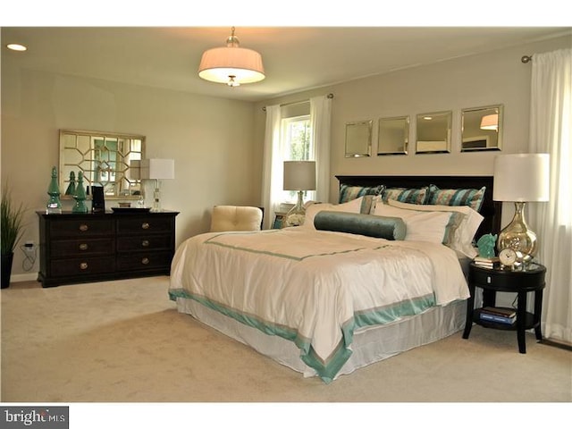 bedroom featuring light colored carpet