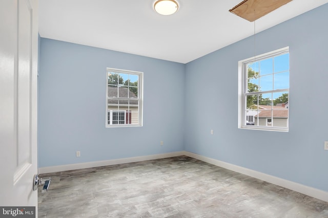 spare room featuring light hardwood / wood-style floors