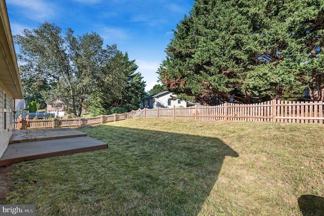 view of yard with a wooden deck