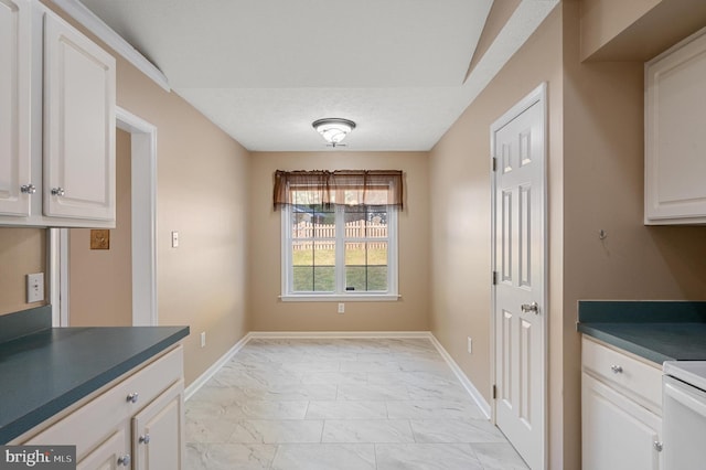 dining room featuring a textured ceiling