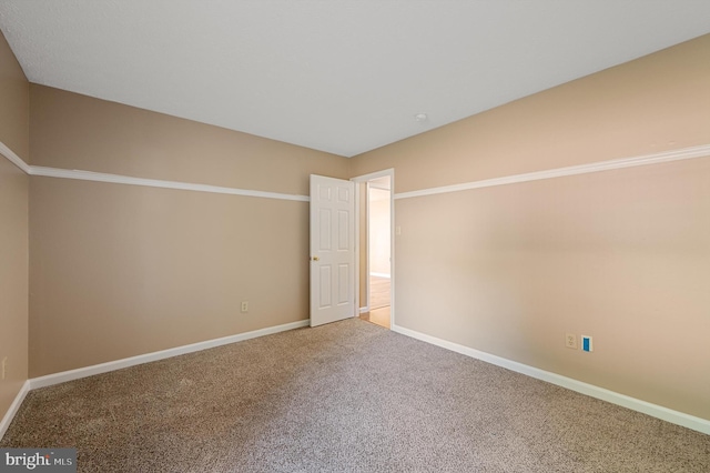 unfurnished room with carpet floors