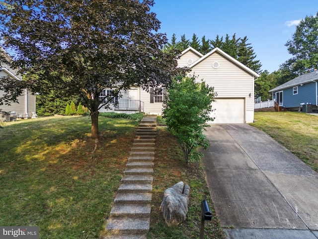 obstructed view of property with a front yard and a garage