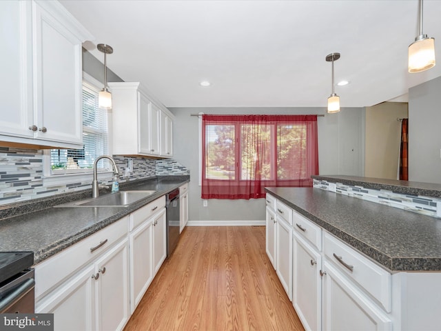 kitchen with pendant lighting, white cabinetry, sink, backsplash, and stainless steel dishwasher