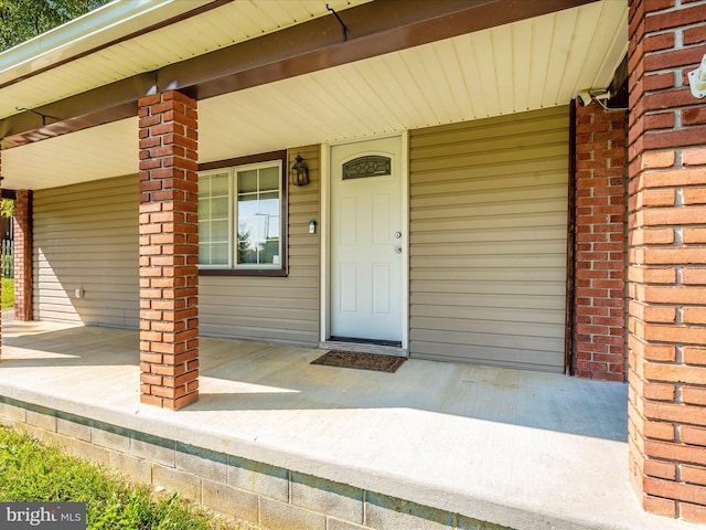 doorway to property with a porch