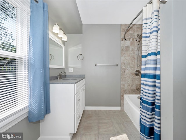 bathroom featuring vanity and shower / bathtub combination with curtain