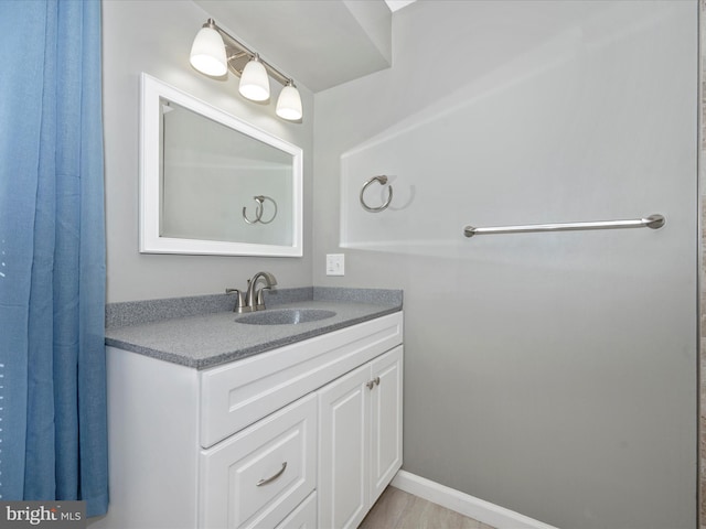 bathroom featuring vanity and wood-type flooring