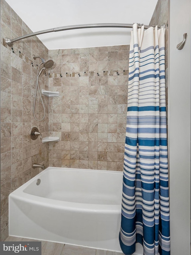 bathroom with shower / bathtub combination with curtain