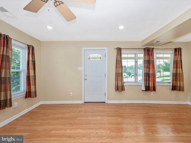 entrance foyer with ceiling fan and light wood-type flooring