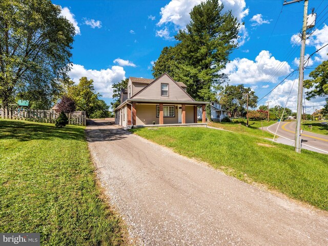 view of front of home featuring a porch and a front yard