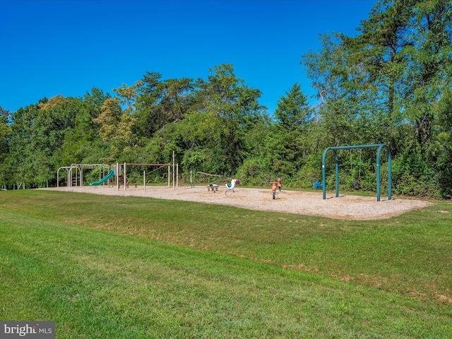 view of playground with a lawn