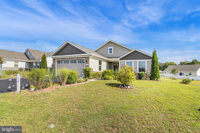 view of front of house featuring a garage, board and batten siding, and a front yard