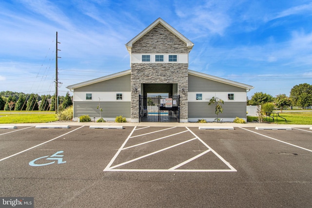 view of property with uncovered parking