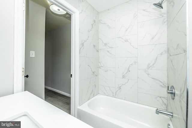 bathroom featuring vanity and tiled shower / bath combo