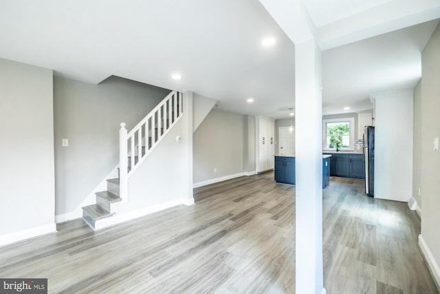 unfurnished living room featuring light wood-type flooring