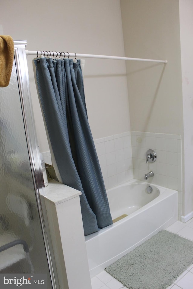 bathroom with tile patterned floors and separate shower and tub