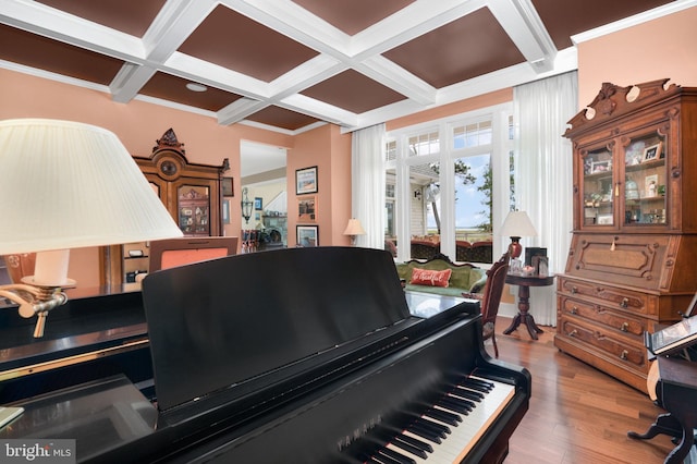 miscellaneous room with ornamental molding, coffered ceiling, wood finished floors, and beam ceiling