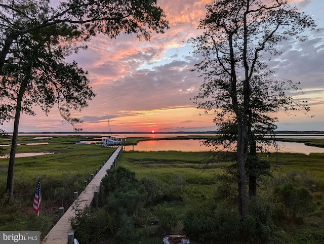 yard at dusk with a water view