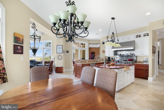 dining area with baseboards and recessed lighting