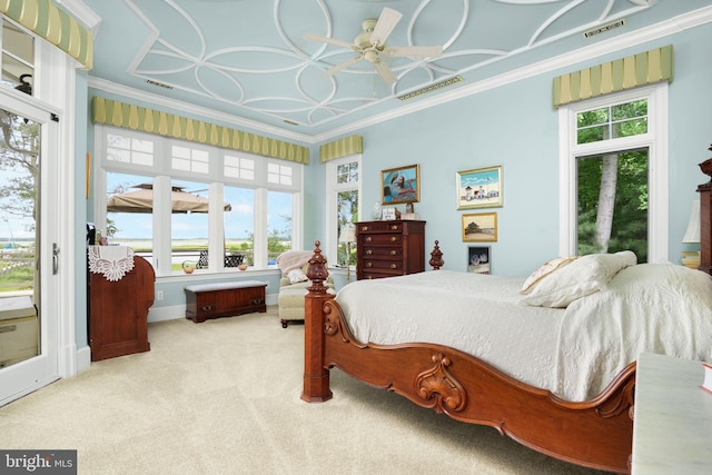 bedroom with ornamental molding, light colored carpet, visible vents, and access to exterior