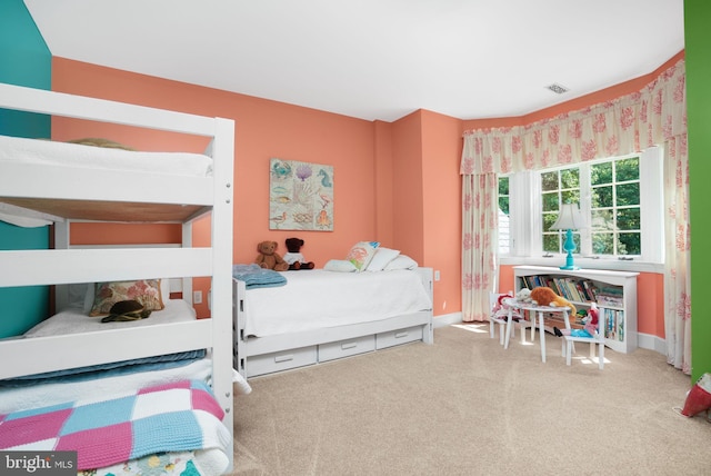 bedroom with carpet flooring, visible vents, and baseboards