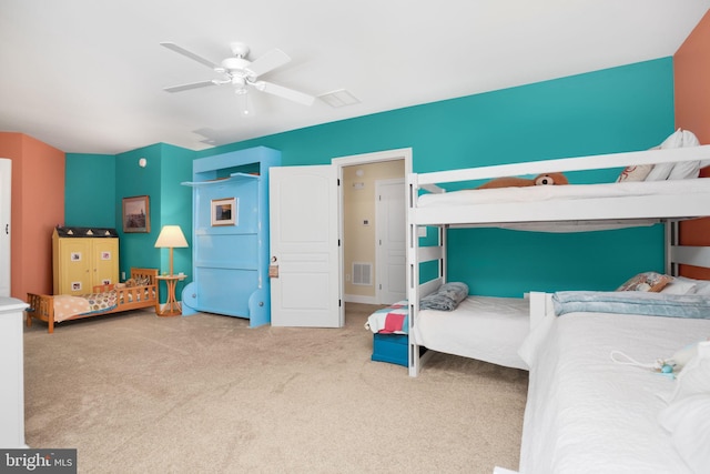 bedroom featuring carpet flooring, ceiling fan, and visible vents