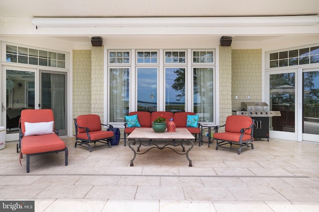 view of patio / terrace featuring an outdoor living space and grilling area