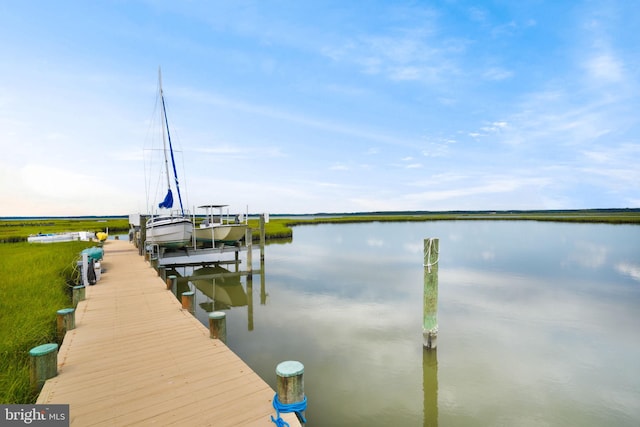 view of dock with a water view and boat lift