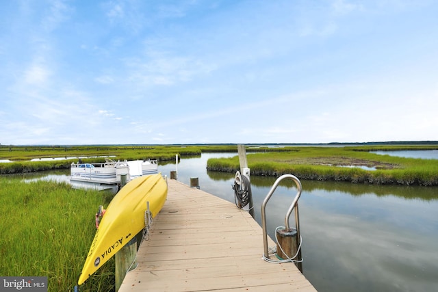 dock area featuring a water view