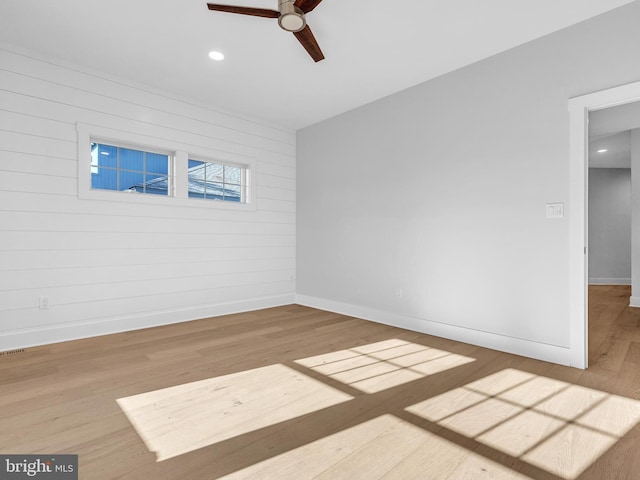 unfurnished room featuring ceiling fan and wood-type flooring