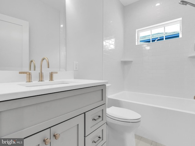 full bathroom with vanity, toilet, and tiled shower / bath