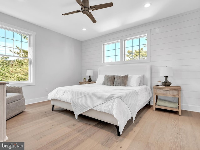 bedroom featuring light hardwood / wood-style flooring and ceiling fan