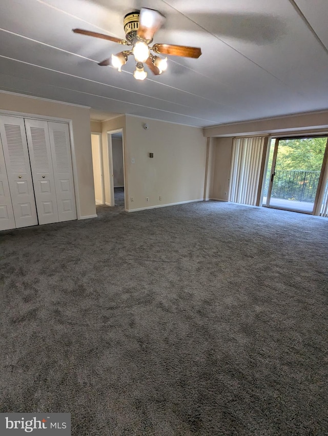 unfurnished bedroom featuring carpet floors and ceiling fan