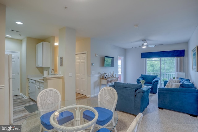 dining area featuring light hardwood / wood-style flooring and ceiling fan