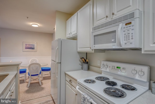 kitchen featuring range and white cabinets