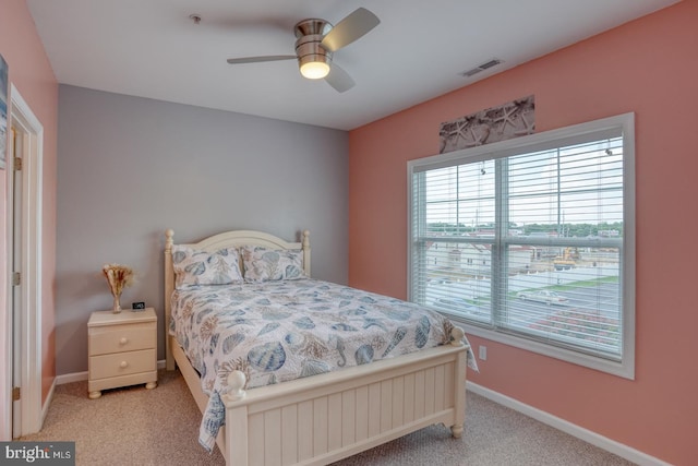 bedroom with ceiling fan and light colored carpet