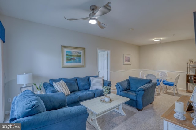 living room featuring ceiling fan and light carpet