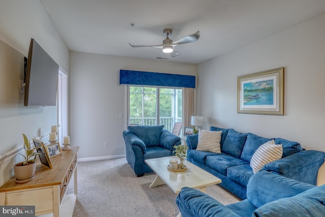 carpeted living room featuring ceiling fan