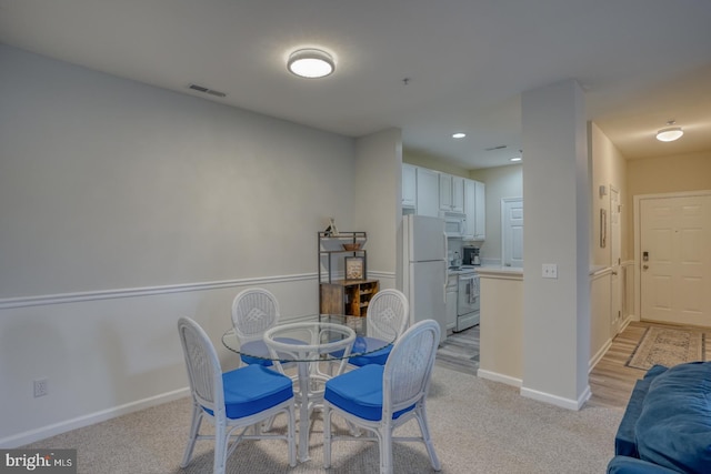 view of carpeted dining area