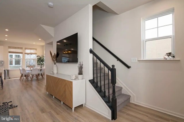 stairway featuring hardwood / wood-style floors