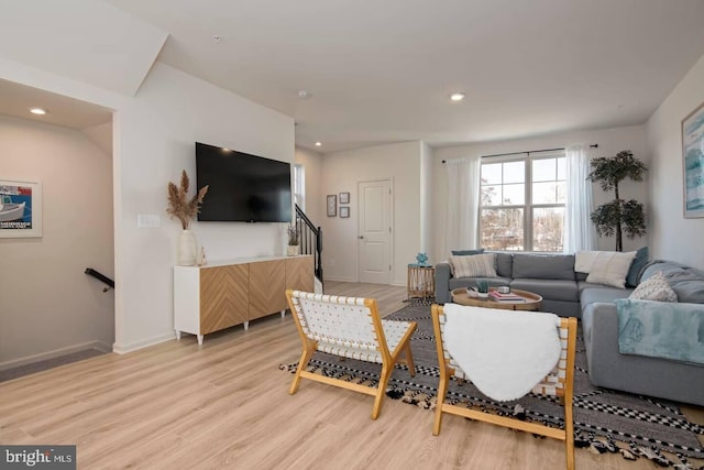 living room with light hardwood / wood-style flooring