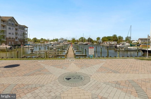 exterior space featuring a water view and a boat dock