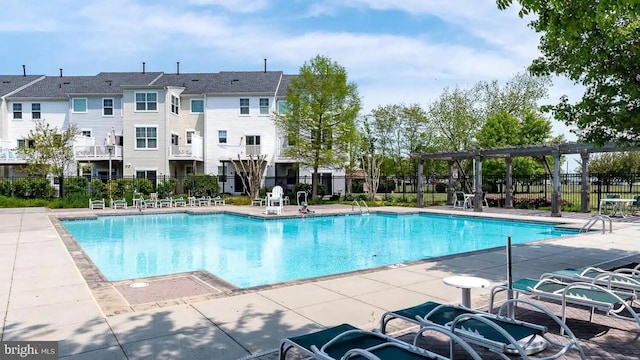 view of swimming pool with a pergola and a patio