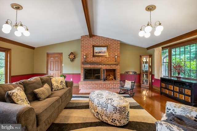 living room featuring vaulted ceiling with beams, brick wall, hardwood / wood-style floors, and an inviting chandelier